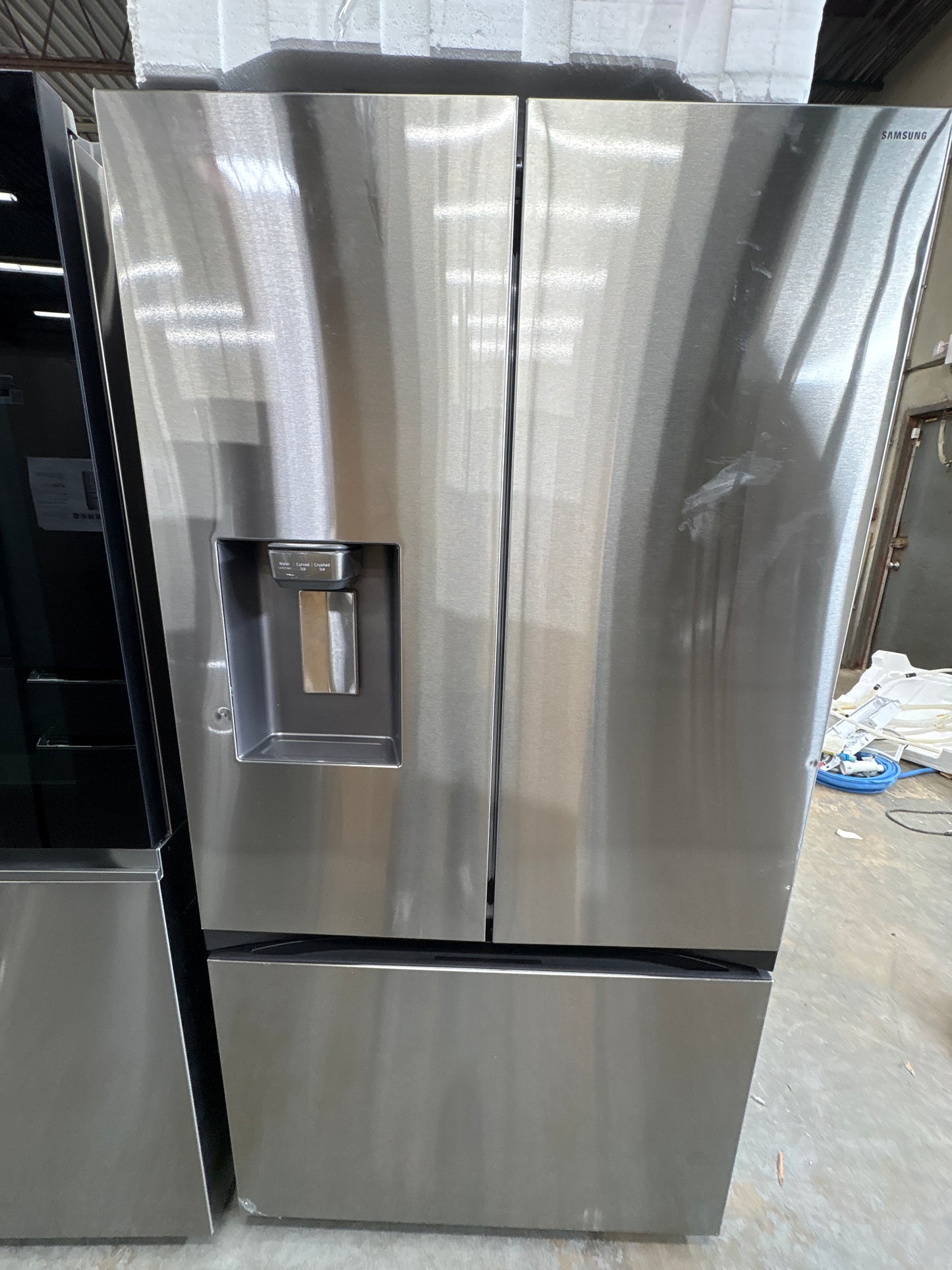 Samsung RF32CG5B10SR 31 cu. ft. Mega Capacity Standard Depth 3-Door French Door Refrigerator with External Water and Ice Dispenser  Dimensions: 35 3/4" W x 70" H x 29 7/16" D  Counter Depth: No  Color: Stainless Steel